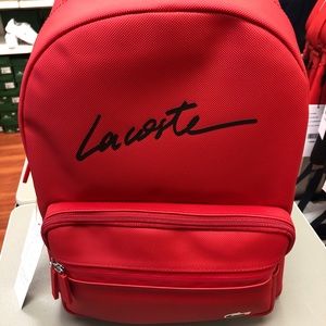 Red backpack from Lacoste.